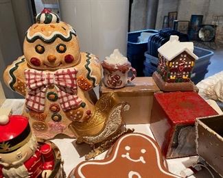 33. Table contents of Christmas items including ceramic gingerbread dishes, carolers and more $65 all