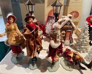 33. Table contents of Christmas items including ceramic gingerbread dishes, carolers and more $65 all