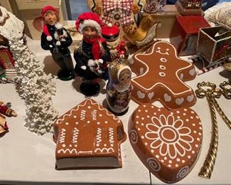33. Table contents of Christmas items including ceramic gingerbread dishes, carolers and more $65 all
