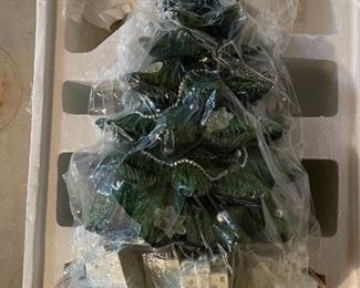 40. Hawthorne Village and Ashton Drake Christmas Village lot.  There a few Small accessory pieces in the blue tub.   Boxes leaning on wall are bases for ice skating rinks, etc.  The Christmas tree is awesome!  $195  all