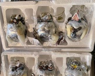 40. Hawthorne Village and Ashton Drake Christmas Village lot.  There a few Small accessory pieces in the blue tub.   Boxes leaning on wall are bases for ice skating rinks, etc.  The Christmas tree is awesome!  $195  all