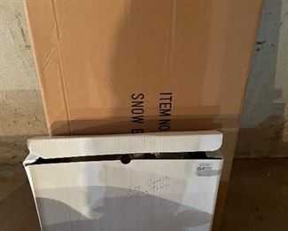 40. Hawthorne Village and Ashton Drake Christmas Village lot.  There a few Small accessory pieces in the blue tub.   Boxes leaning on wall are bases for ice skating rinks, etc.  The Christmas tree is awesome!  $195  all