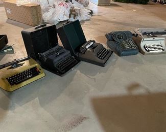 49. Set of 4 typewriters and one adding matching.  Royal and remington and more $75