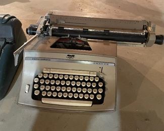 49. Set of 4 typewriters and one adding matching.  Royal and remington and more $75