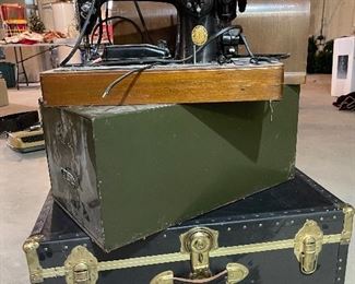 48. Singer Sewing machine with wood domed lid and 1 older black trunk, and metal file cabinet $55