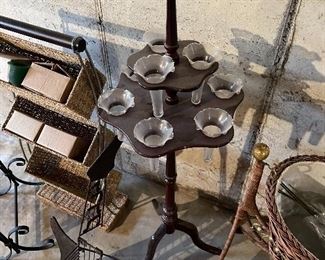 52. Lot of 5 pieces, guitar cd rack, wicker basket rack, magazing stand, glass vase 2 tiered table, and a cool decorative bassinet $70