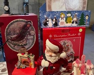 55. Table of christmas stuff including drum, stuffed stockings, bear, silverplate rose things, and more $60