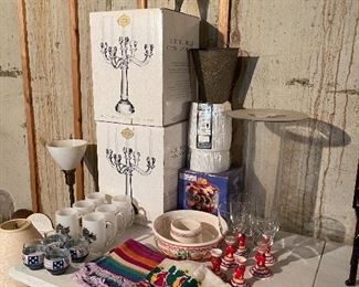 60.  Two matching crystal or glass candelabras, glassware, old 60s hand printed napkins and more $60