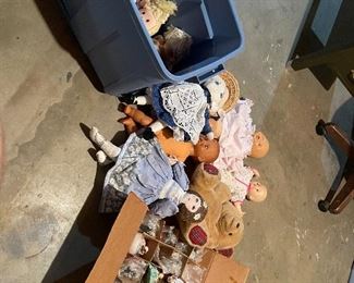 63. Dolls, dolls and some 1940s paper mache little individual guys. Also a Barbie Kaboodle and barbie card game and small wood blue dining set for a doll $50