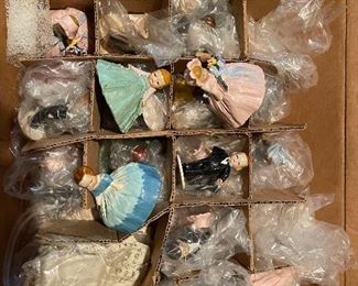 63. Dolls, dolls and some 1940s paper mache little individual guys. Also a Barbie Kaboodle and barbie card game and small wood blue dining set for a doll $50