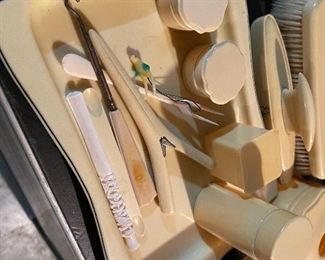 64. Some bakelite, and something else.  Makeup set with mirrors and more including perfum bottles $75