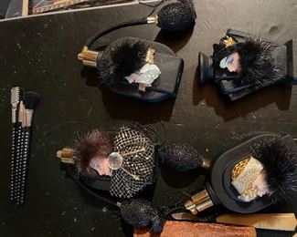 64. Some bakelite, and something else.  Makeup set with mirrors and more including perfum bottles $75