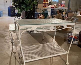 68. 2 metal tables with glass tops and one tricycle planter $40