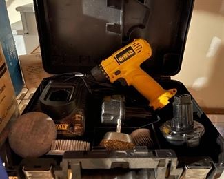 69. Two Plastic shelves with Super 8 Camera, drill, and some cookware $35