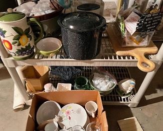 70. TWO shelves and box of cookware and dishware and planters $35