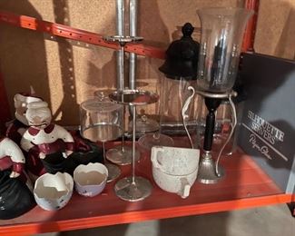 75. Orange metal shelf wtih contents including sugar and creamers, old glassware, tea kettle, two light fixtures and more (Fan in box on left not included) $50