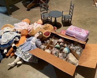 63. Dolls, dolls and some 1940s paper mache little individual guys. Also a Barbie Kaboodle and barbie card game and small wood blue dining set for a doll $50