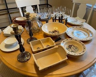 80. Table contents including candlesticks and matching wine glasses, and some Poppytail plates/ bowls. $75