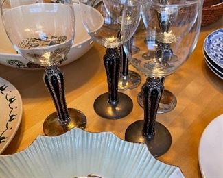 80. Table contents including candlesticks and matching wine glasses, and some Poppytail plates/ bowls. $75