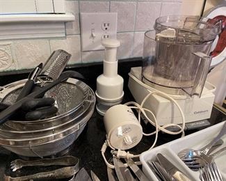 88. Nice set of flatware, cuisinart food processor, hand chopper and some knives. $65