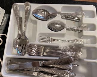 88. Nice set of flatware, cuisinart food processor, hand chopper and some knives. $65