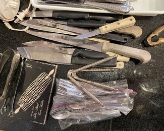 88. Nice set of flatware, cuisinart food processor, hand chopper and some knives. $65