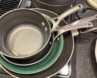 89. Soup Tureen, candelsticks, Calphalon pots and pans and other serving pieces. $100