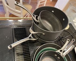 89. Soup Tureen, candelsticks, Calphalon pots and pans and other serving pieces. $100