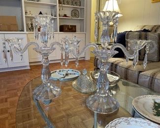 90.  Glass table full of plates and 2 amazing Crystal Candelabras $75