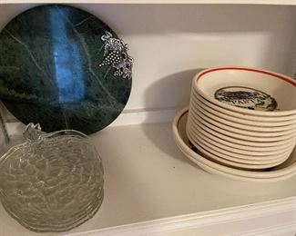 92. 8 shelves of items, including plates, clocks, and more $40