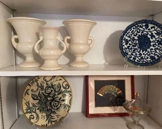 92. 8 shelves of items, including plates, clocks, and more $40