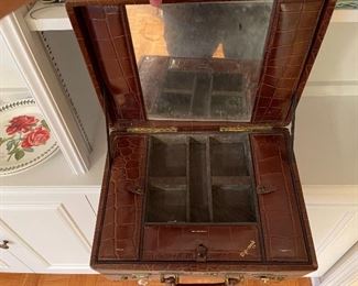 94. Six shelves including blue spode plates, and more with leather vintage makeup bag carrying case suitcase $65