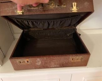 94. Six shelves including blue spode plates, and more with leather vintage makeup bag carrying case suitcase $65