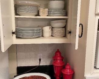 97. Cabinet of dishes and plates and bowl with decorative italian waiter items $50