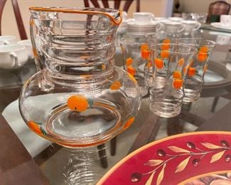 101. Green Vaseline ware and 2 other plates with an awesome old hand painted orange juice pitcher and cups  $ 50