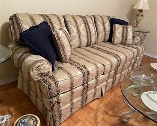 104. Beautiful and rarely used striped sofa $250