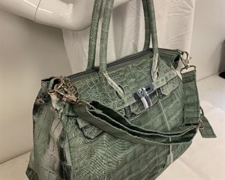 Mousse Handbag; made from a durable nylon. Features an interior zipper compartment and is very good condition. Measures about 13" x 9.5" 