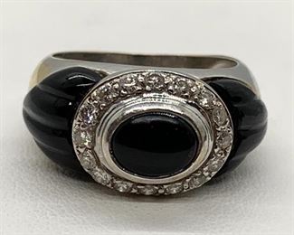 18K and Black Onyx Ring - Truly stunning!  The stones surrounding the onyx are likely small diamonds, but not tested.  Marked inside 18K and size 5.5 and weighs 8 grams. 
