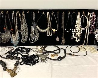 From the Jewelry Box! - lots of sparkles and fun here! Includes 25 necklaces in a variety of styles and sizes, five bracelets, one pair of clip on earrings and four brooches. 