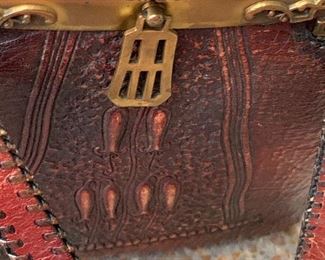 Vintage/Antique Nacona Hand-Tooled Leather Handbag. An incredibly beautiful Nocona leather purse embossed in a distinct Arts and Crafts or Art Deco era design. The bag dates to the early 1920's era