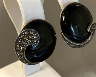 Very nice pair of sterling earrings by Judith Jack with marcasite detailing. Round black clip earrings. Reverse is hallmark for Judith Jack and marked sterling. 