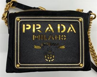 PRADA Handbag with Certificate of Authenticity. Light signs of wear.

ART: BT0606
Material: Tessuto Oro
Colo: Nero
Inside zipper compartment 
Adjustable strap from about 20" to 23")
Measures about 6.5" x 4.7" 