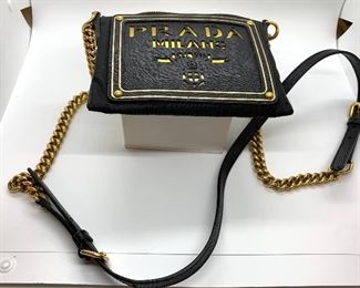 PRADA Handbag with Certificate of Authenticity. Light signs of wear.

ART: BT0606
Material: Tessuto Oro
Colo: Nero
Inside zipper compartment 
Adjustable strap from about 20" to 23")
Measures about 6.5" x 4.7" 