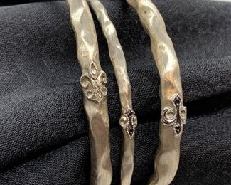 Three Sterling Bangle Bracelets by Rhonda Faber Green - measuring 2.5" inside diameter. 
