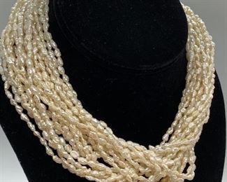 Multi-Strand Pearl Necklace w/ 14k Clasp. Truly a lovely piece of jewelry. Pearls are a classic piece of jewelry that every woman should own. Measures about 16" long and clasp is marked HB 2 and 14k