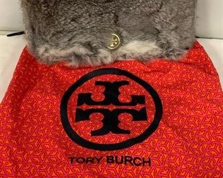 Vintage Tori Burch Rabbit Fur Handbag. This great bag does come with a dust cover. It has leather straps that are adjustable and a leather interior. The bag is 10.5 by 6.5 inches. It is in very good condition. It has not been authenticated, however; it is believed to be genuine. 