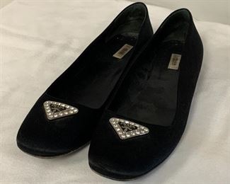 Wonderful pair of black flats by Prada.  In gently used condition- still lots of wear left in these fun shoes!  Size 38.5. Features a beautiful triangle rhinestone design on the toe.
