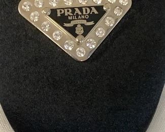 Wonderful pair of black flats by Prada.  In gently used condition- still lots of wear left in these fun shoes!  Size 38.5. Features a beautiful triangle rhinestone design on the toe.