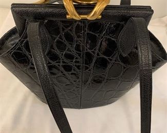 Amazing vintage Glen Miler for Ann Turk Handbag- 1980's. Truly a piece of history! The patent leather has a patterned design and it also has a gold tone alligator clasp. The bag measures 9 inches tall and 10 inches wide. The scarf in the photos is not included. Bag is in good condition with light wear. 