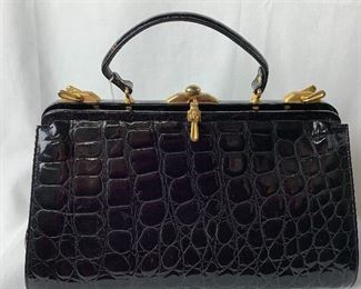 Coco Bidente Handbag with gold tone detailing and pattern patent leather. Beautiful handbag with some light wear, but overall, in good condition. Measuring approximately 13.5" x 9"